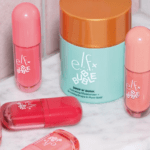 Assorted e.l.f. x Bubble makeup and skin-care products, including blush, lip and bronzing formulas, arranged on a marble surface.