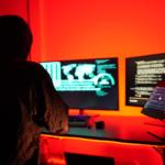 Hackers work secretly in secret rooms. Mysterious colored lights Breaking into personal security and various agencies in the world . Wanted Hacker using computer for hacking in the cyber data center .