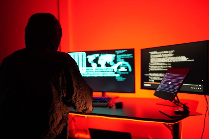 Hackers work secretly in secret rooms. Mysterious colored lights Breaking into personal security and various agencies in the world . Wanted Hacker using computer for hacking in the cyber data center .